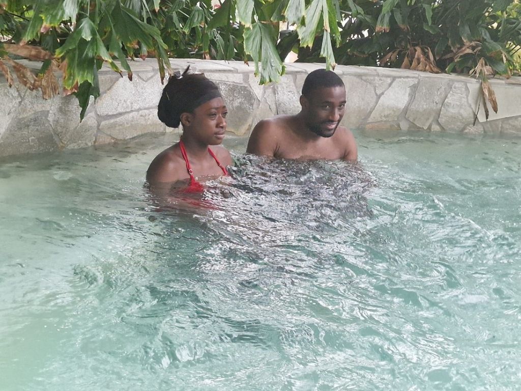carer with a man in a swimming pool
